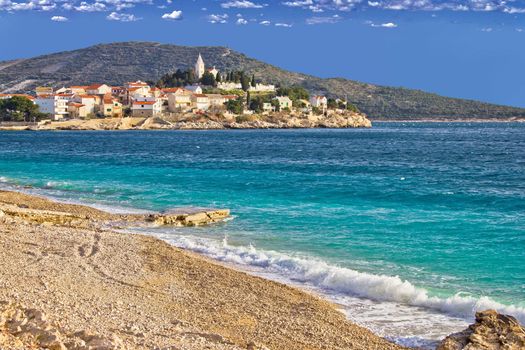 Town of Primosten turquoise sea and pebble beach, Dalmatia, Croatia