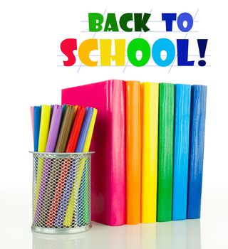 Row of colorful books and felt pens over white background