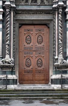 Fragment of old building and nice wooden door with fillet