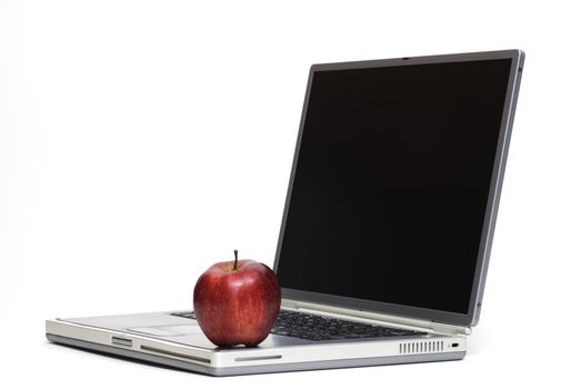 Macintosh sitting on a laptop