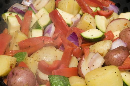 Selective focus on foreground with steam rising from the vegetables cooked on the BBQ