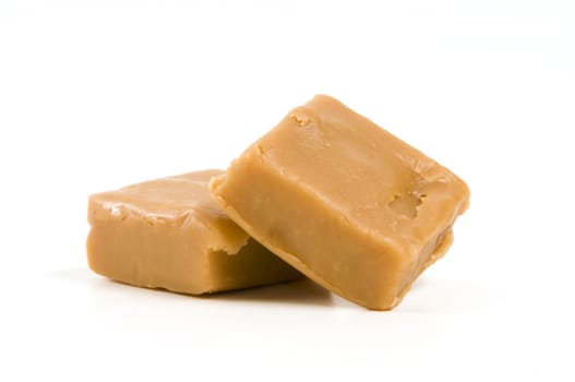 Two pieces of fudge isolated on white background