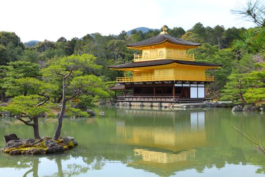 Kyoto, Japan - Golden Pavillion shariden at famous Kinkakuji (Kinkaku-ji) Temple. Buddhist zen temple of Rinzai school.