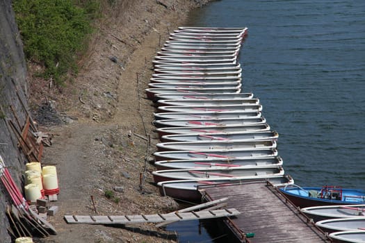 Fishing boats - tens of vessels at a pier in Lake Shojiko, Japan