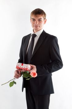 Portrait of a young successful businessman with a flower in your hand