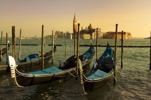 empty Venetian gondolas moored.Evening in Venice