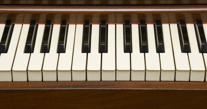Closeup of Piano Keys on 60's instrument.