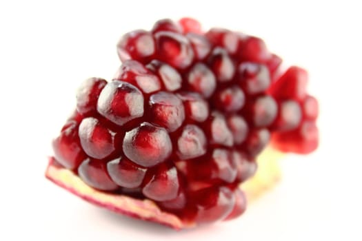Part of pomegranate on white background.