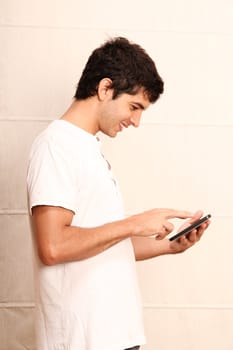 A young hispanic man using a Tablet PC.