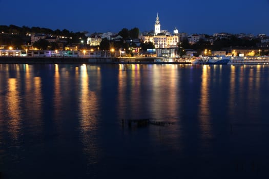 Belgrade, Serbia - capital city view at night. Illuminated cityscape.