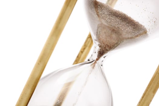 Close up of hourglass isolated on white background, selective focus 