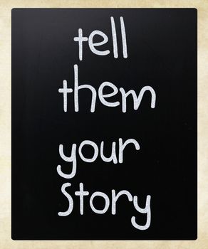 "Tell them your story" handwritten with white chalk on a blackboard