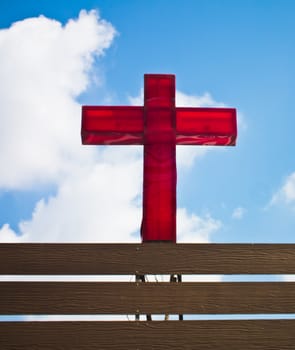 this is a red cross on blue sky background