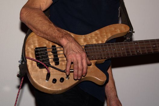 Portrait shot of a bass guitar player with guitar