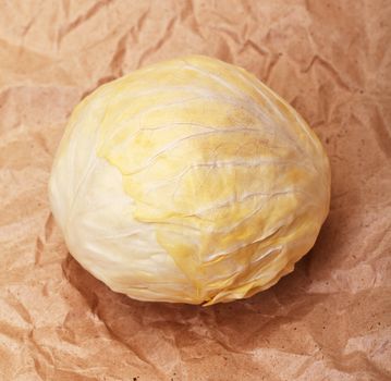 cabbage on brown crumpled recycled paper