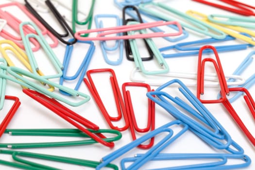 Colorful paper clips  on white