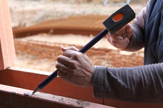 Man working on a window frame