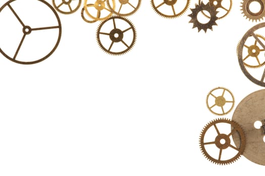 Cogs and other watch parts isolated on white background with copy space.