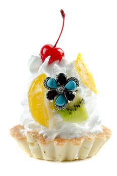 cupcake and bijouterie flower on a white background