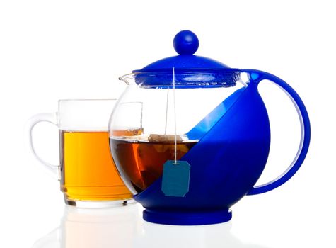 transparent teapot with black tea bag 