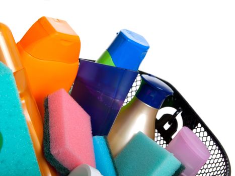 basket full of plastic bottles for cleaning supplies, lotion, shampoo etc. isolated on white background. (A shopping) 