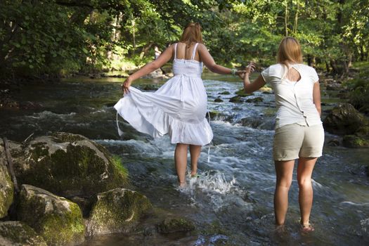 Two Girls In White Crossing The Cold Stream