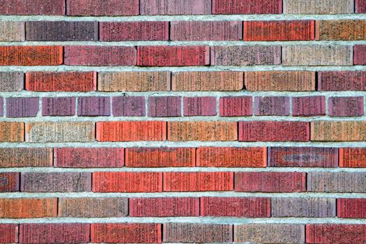 Vibrant multi color red brick wall pattern