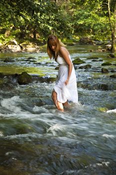 Girls With White Wet Dress Walking Cross The Stream, Cold Water, Eco tourism