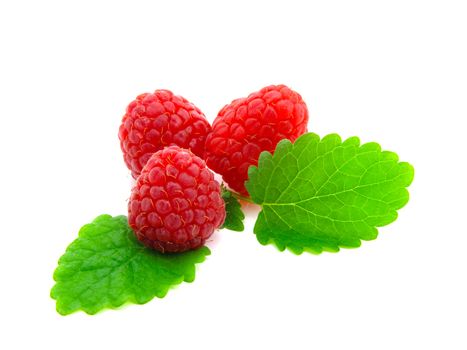 Raspberries with green leaves on white background 