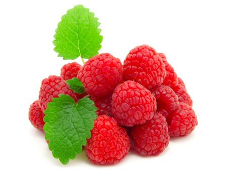 Raspberries with green leaves on white background