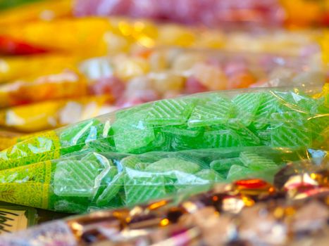 market stand of colorful candies in the package