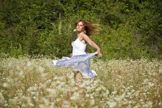 Woman In White Dress Dancing In Nature