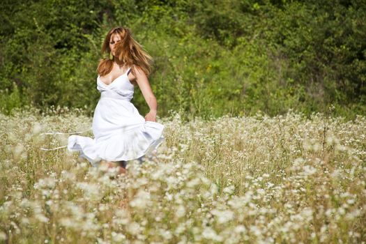 Woman In White Dress Dancing In Nature