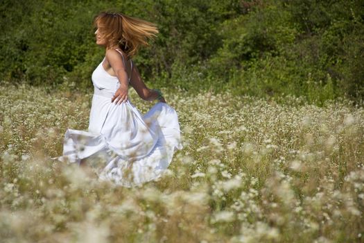 Woman In White Dress Dancing In Nature