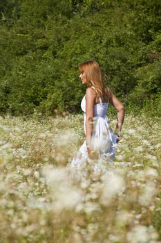 Woman In White Dress Dancing In Nature