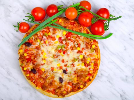 Pizza with red cherry tomatos and green onion