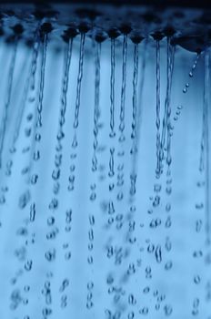 water drops falling from a shower indoors