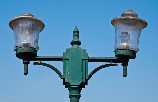 This is a old light pole body of pole have a green colour