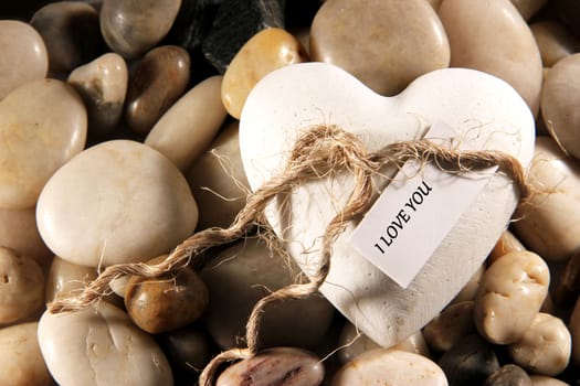 Cocept of heart with text I love you on pebbles