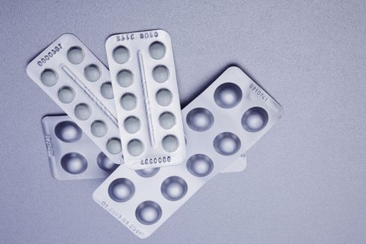 Silver Pills On Metal Table Background, copy space