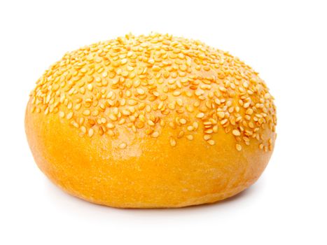 One tasty baked rolls with sesame isolated on a white background