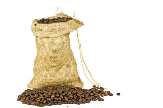 Coffee beans in a jute bag on a white background