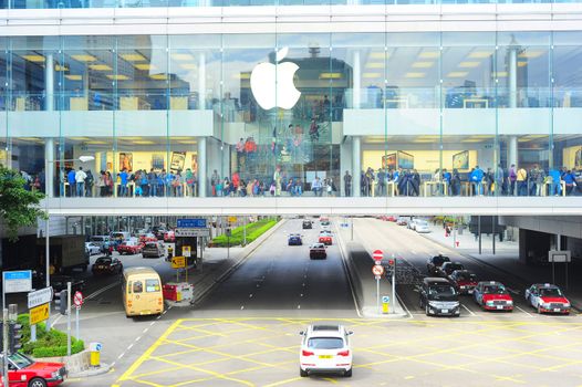 Hong Kong - January 21, 2013: Customers at Apple store  in Hong Kong. In 2012, Apple sold 172 million iPods, iPhones and iPads, These post-PC devices making up a total of 76-percent of Apple's revenue.