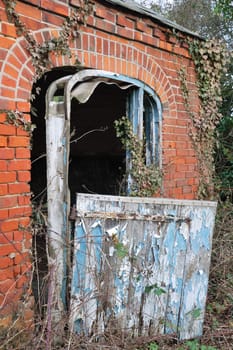 Old brick building with wooden door