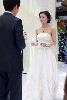 a young couple exchange vows on their wedding day