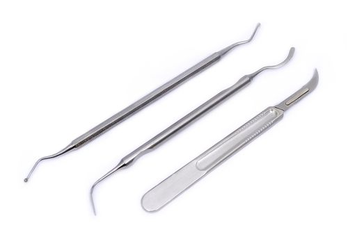set of dental appliances: a scalpel, plugger and excavators