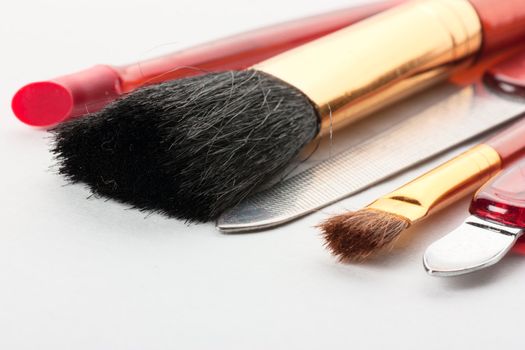 Closeup view of makeup tools: brushes and nail file