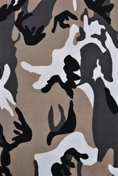 Close up camouflage fabric in a vertical orientation