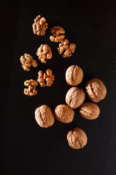 walnuts on black background