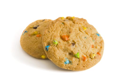 Two candy chip cookies on white background - with selective focus on the foreground